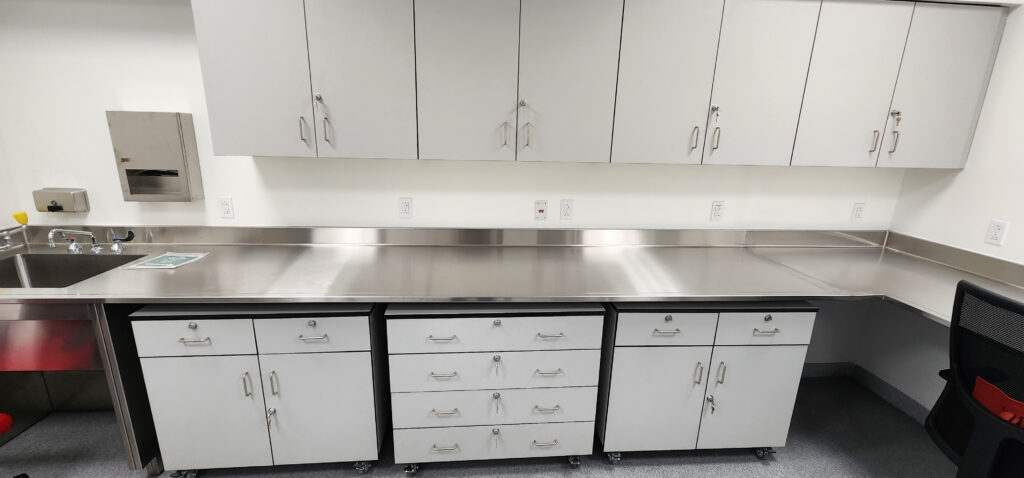 Stainless Steel Countertop Welded in Place with Phenolic Cabinets